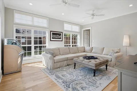 a living room with furniture a table and a window