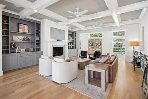 a living room with fireplace furniture and a flat screen tv