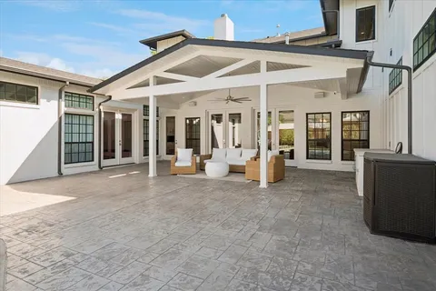 a view of a house with porch and furniture