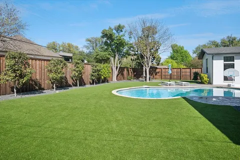 a view of a backyard with a garden
