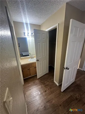 a white toilet sitting next to a shower curtain