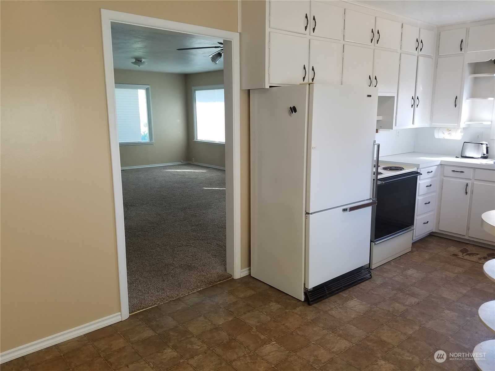 2820 Midvale Road Mabton, WA 98935 - Photo 14 of 30 a view of a kitchen with refrigerator