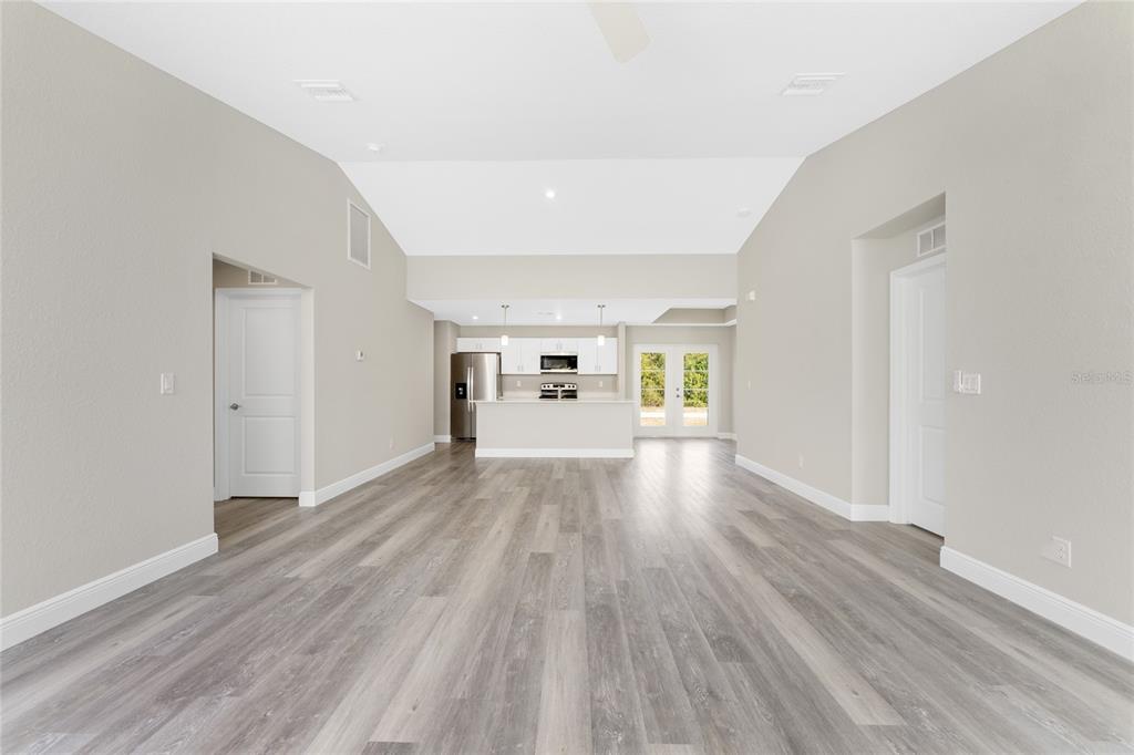 6397 Filbert Street North Port, FL 34288 - Photo 17 of 71 wooden floor in an empty room with a window
