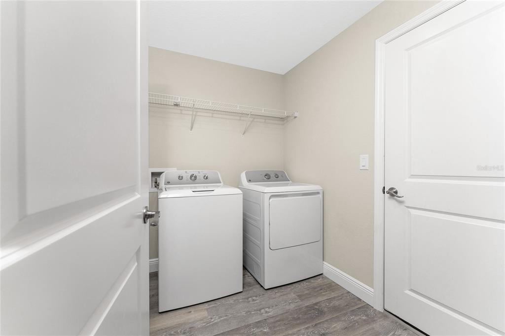 6397 Filbert Street North Port, FL 34288 - Photo 21 of 71 a view of storage and utility room with washer and dryer