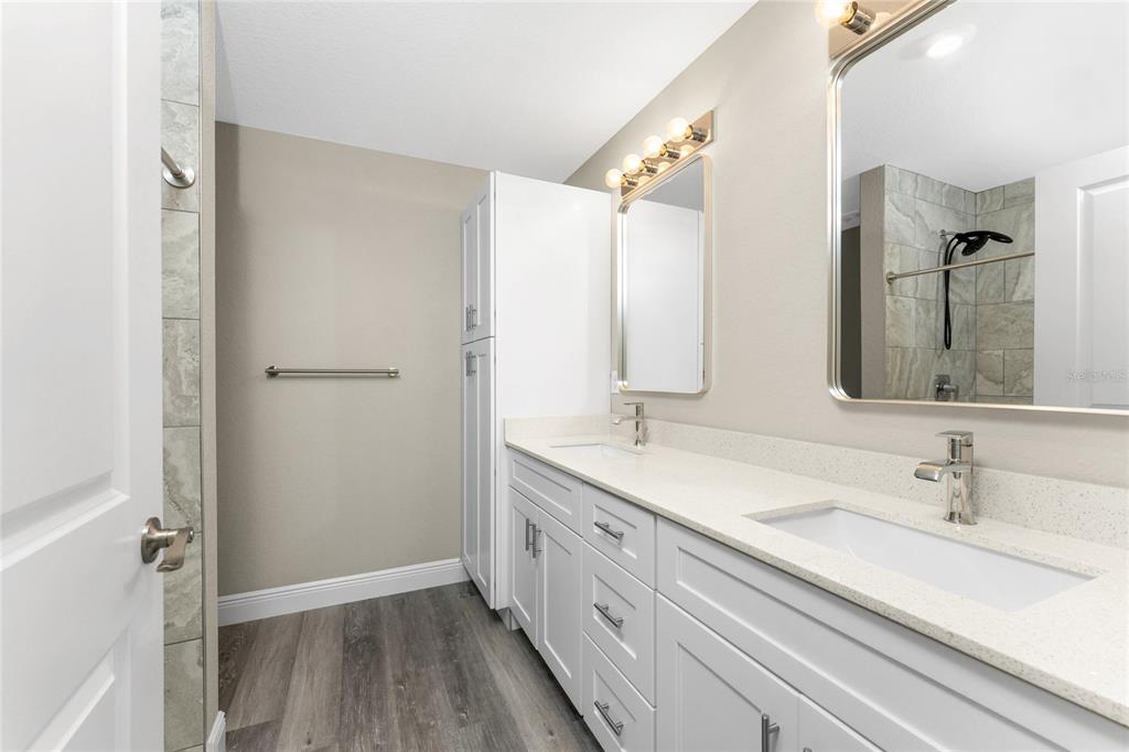 6397 Filbert Street North Port, FL 34288 - Photo 29 of 71 a bathroom with a double vanity sink mirror and