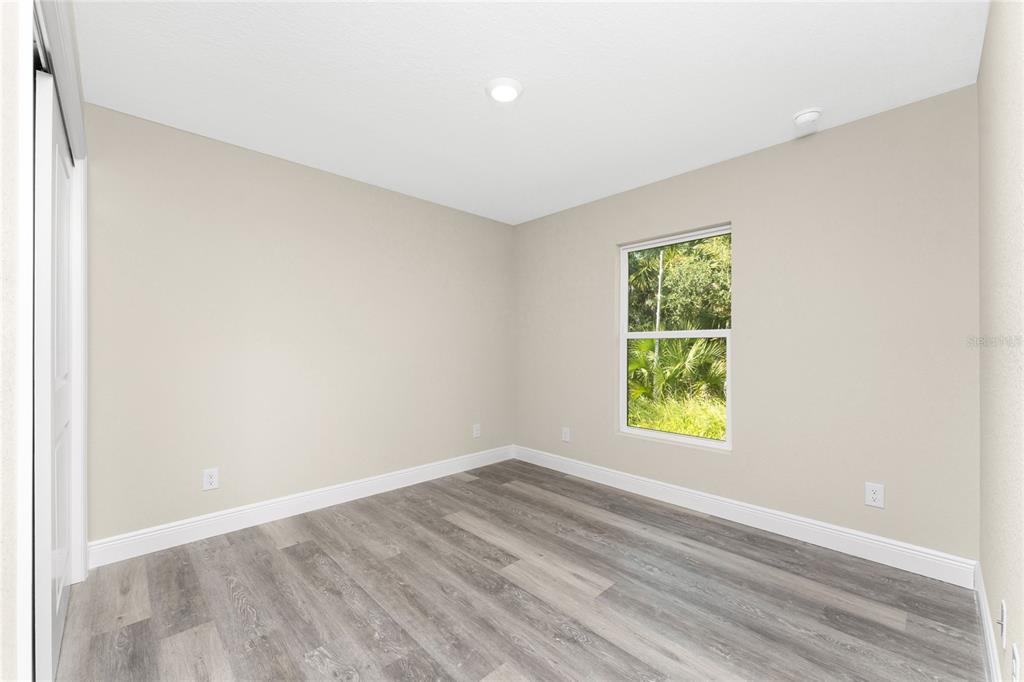 6397 Filbert Street North Port, FL 34288 - Photo 32 of 71 an empty room with a window