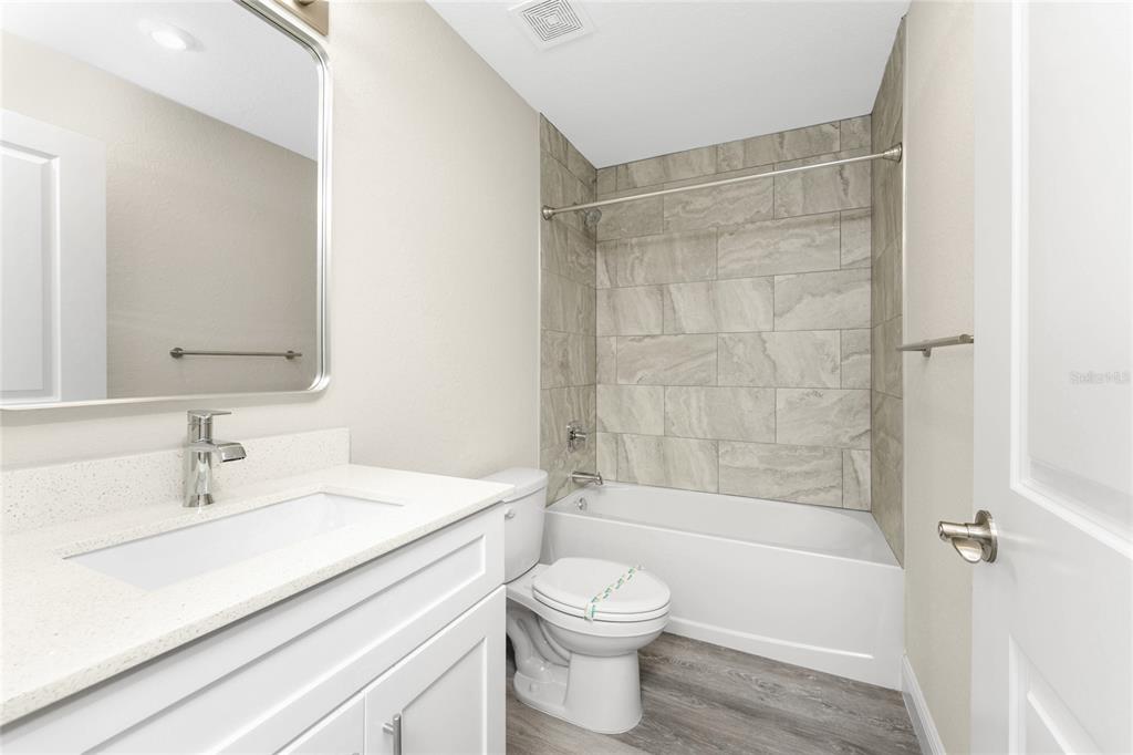 6397 Filbert Street North Port, FL 34288 - Photo 35 of 71 a bathroom with a sink a toilet and shower