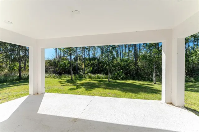 a view of a swimming pool with an outdoor seating and yard