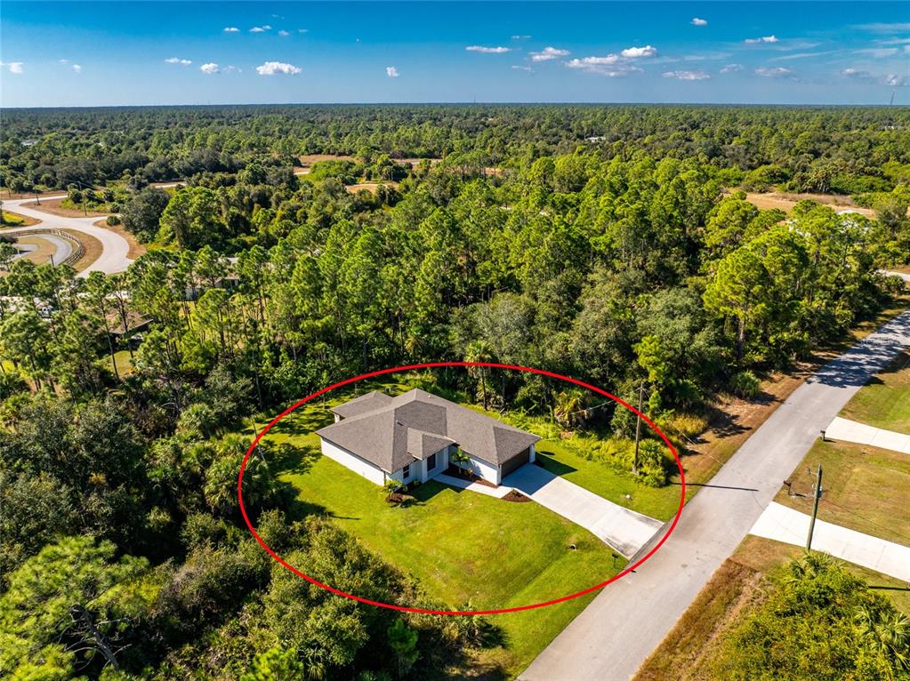 6397 Filbert Street North Port, FL 34288 - Photo 58 of 71 a view of a swimming pool with an outdoor seating and yard