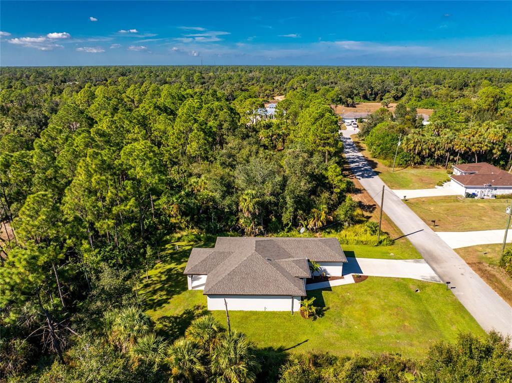 6397 Filbert Street North Port, FL 34288 - Photo 61 of 71 a view of a swimming pool with an outdoor seating and yard