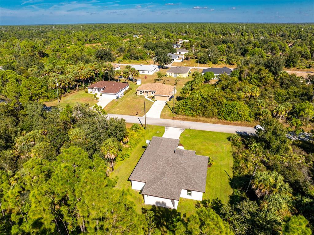 6397 Filbert Street North Port, FL 34288 - Photo 65 of 71 an aerial view of residential houses with outdoor space