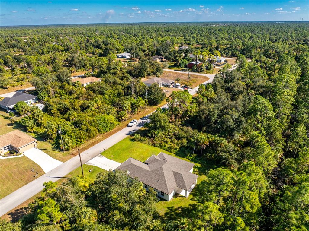 6397 Filbert Street North Port, FL 34288 - Photo 67 of 71 a view of a yard with an outdoor seating