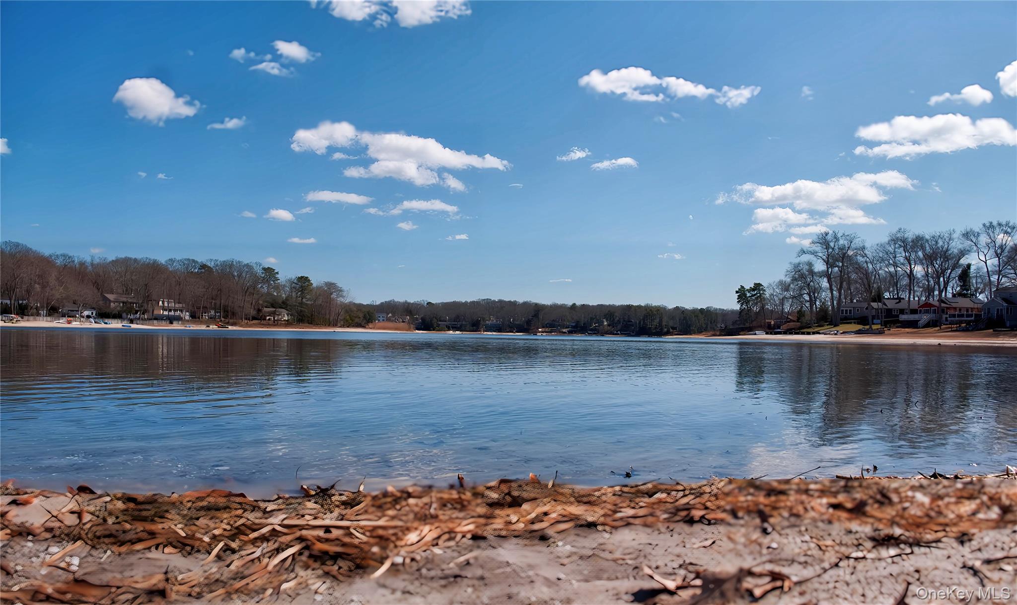 215 Lakeside Trail Ridge, NY 11961 - Photo 18 of 19 a view of a lake with houses