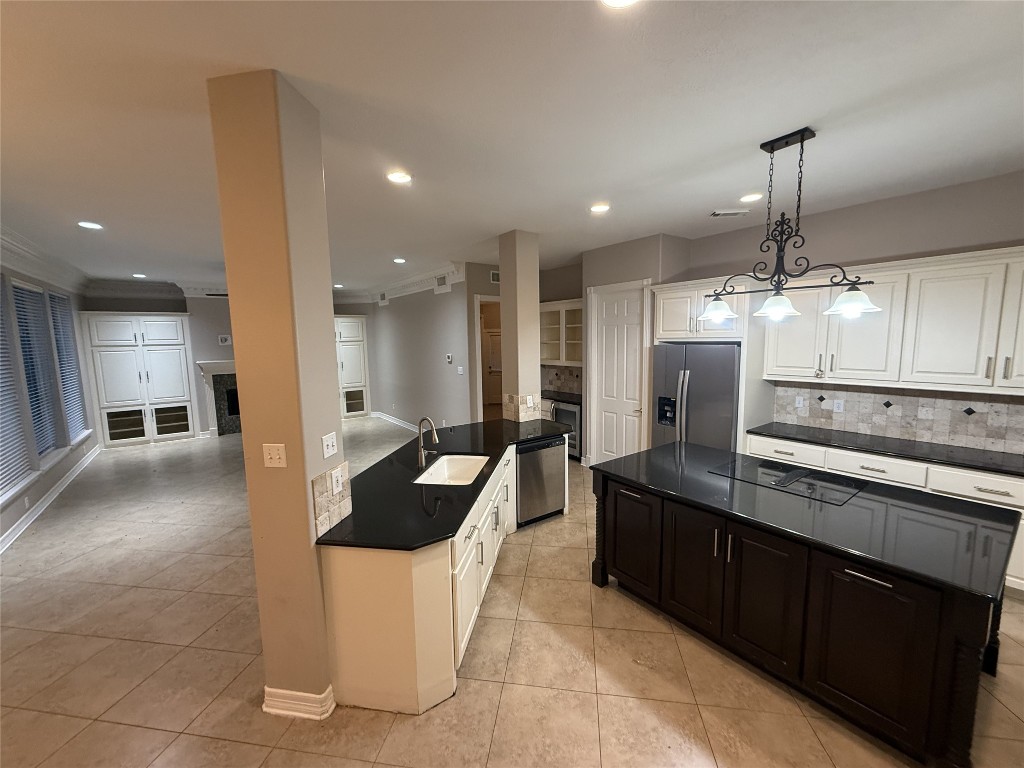 13523 Pegasus Road Cypress, TX 77429 - Photo 14 of 36 a large kitchen with stainless steel appliances kitchen island granite countertop a sink and a refrigerator