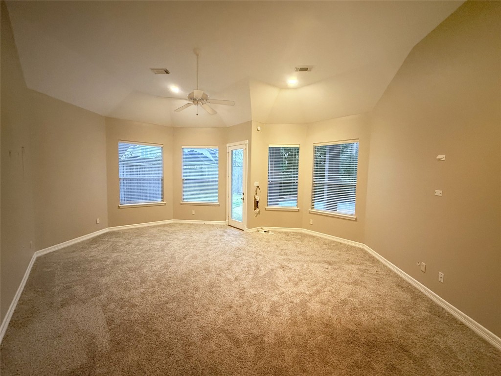 13523 Pegasus Road Cypress, TX 77429 - Photo 17 of 36 a view of an empty room with a window