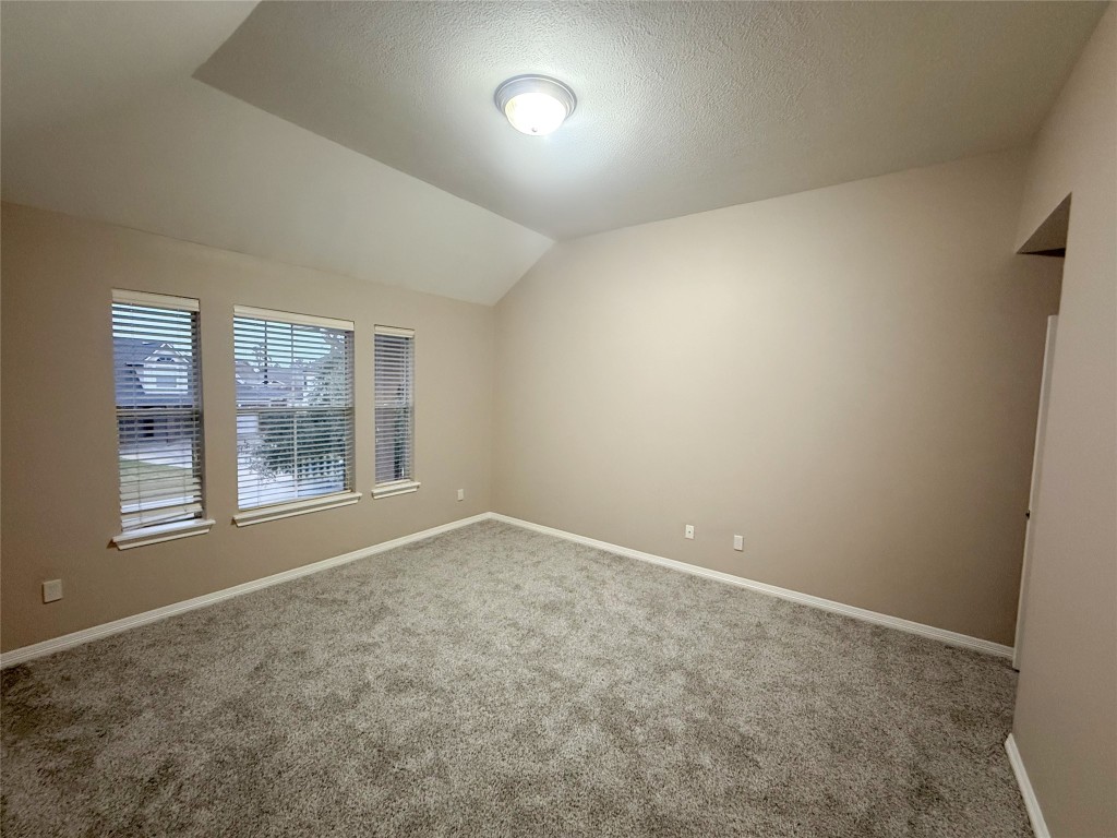 13523 Pegasus Road Cypress, TX 77429 - Photo 18 of 36 an empty room with a empty space and windows