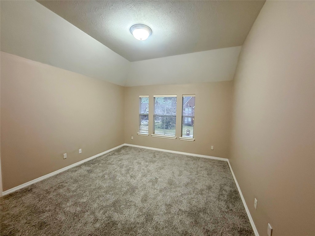 13523 Pegasus Road Cypress, TX 77429 - Photo 19 of 36 an empty room with a empty space and windows