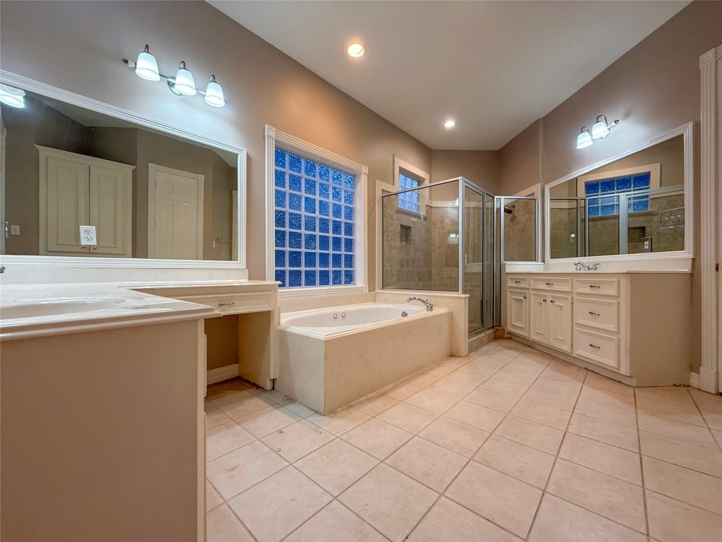 13523 Pegasus Road Cypress, TX 77429 - Photo 26 of 36 a large bathroom with a large tub shower and sink