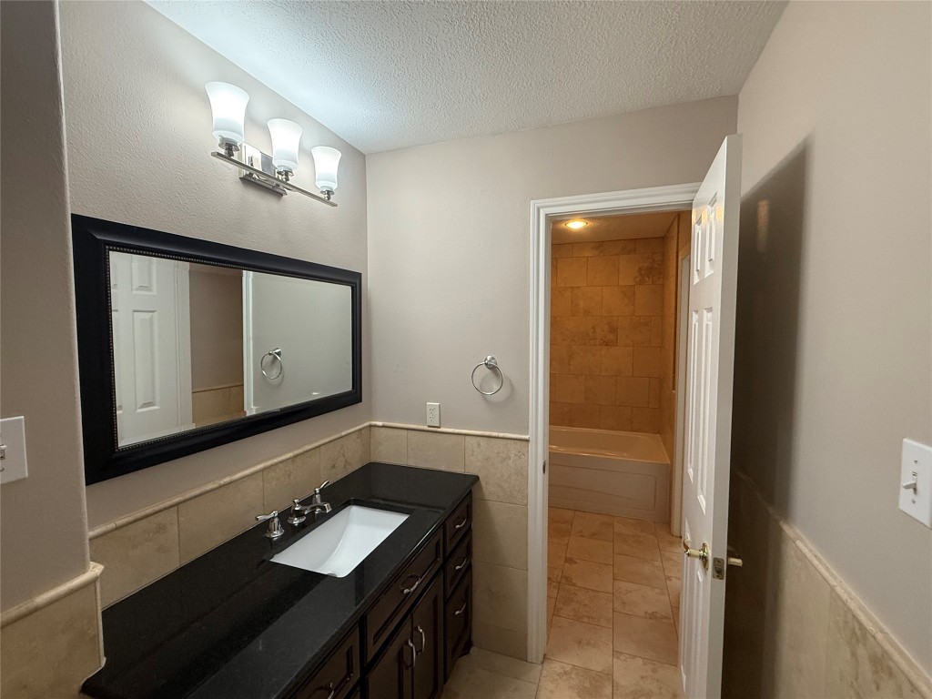 13523 Pegasus Road Cypress, TX 77429 - Photo 27 of 36 a bathroom with a sink a light fixture and a mirror