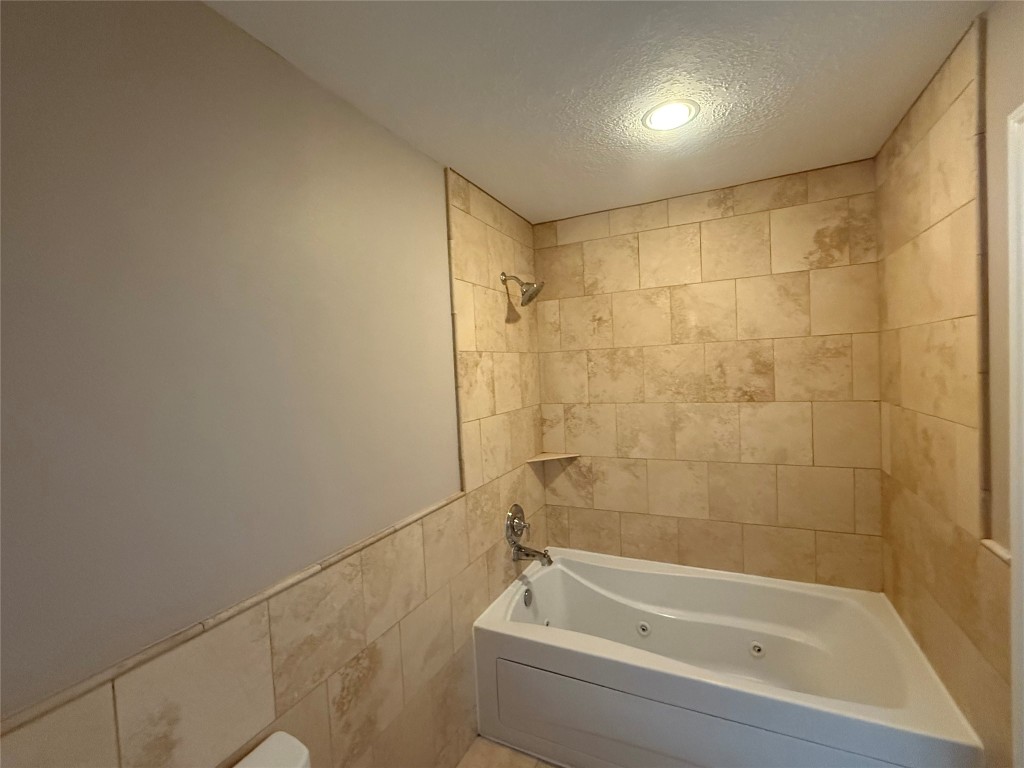 13523 Pegasus Road Cypress, TX 77429 - Photo 28 of 36 a bathroom with a shower and bathtub