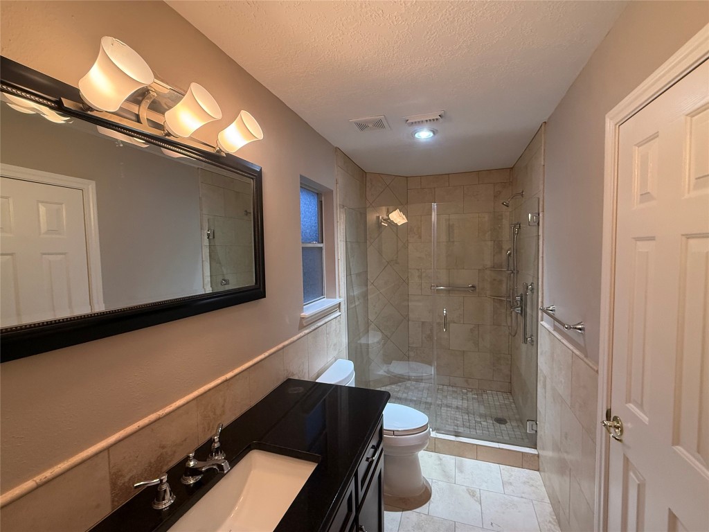 13523 Pegasus Road Cypress, TX 77429 - Photo 30 of 36 a bathroom with a bathtub and a shower