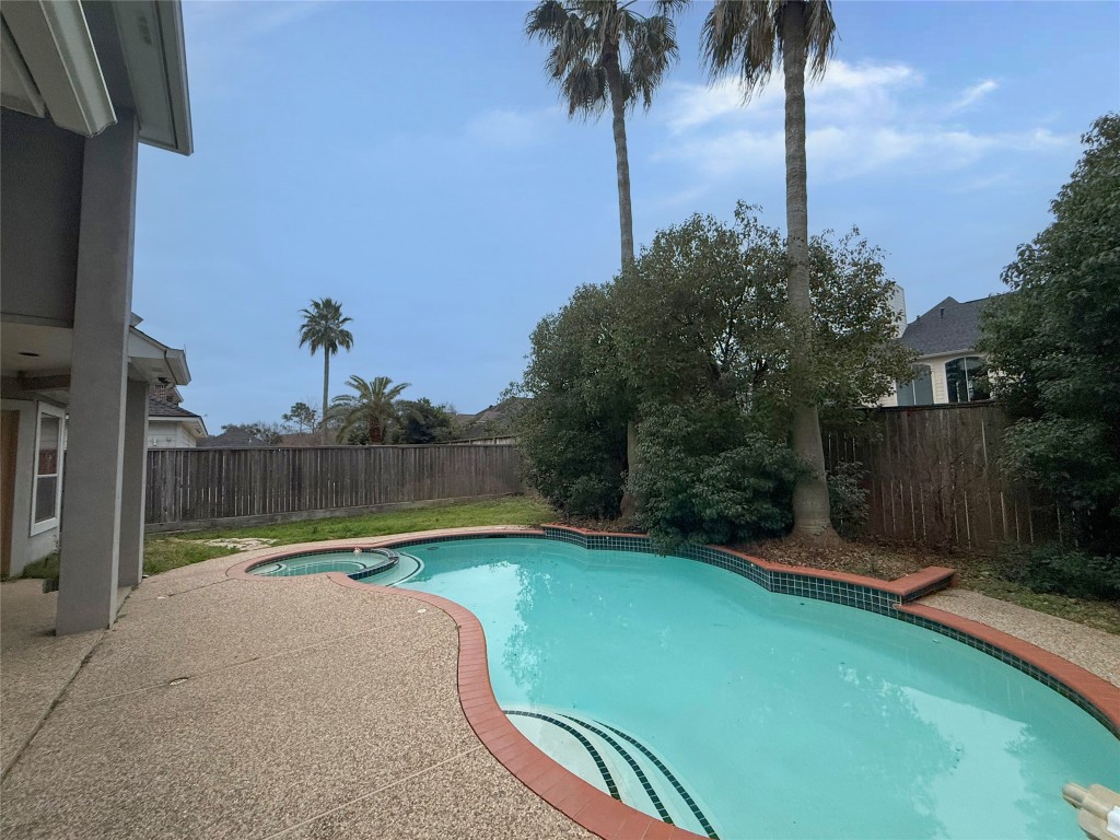 13523 Pegasus Road Cypress, TX 77429 - Photo 35 of 36 a view of a backyard with palm trees