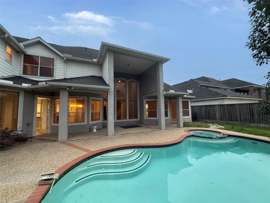 13523 Pegasus Road Cypress, TX 77429 - Photo 36 of 36 a view of a house with swimming pool and porch