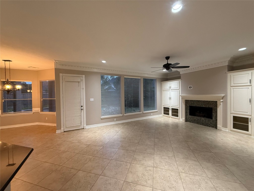 13523 Pegasus Road Cypress, TX 77429 - Photo 5 of 36 a view of an empty room with a fireplace and a window