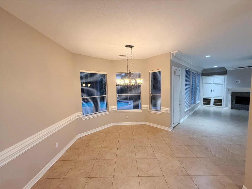 13523 Pegasus Road Cypress, TX 77429 - Photo 6 of 36 a view of an empty room with a window and kitchen view