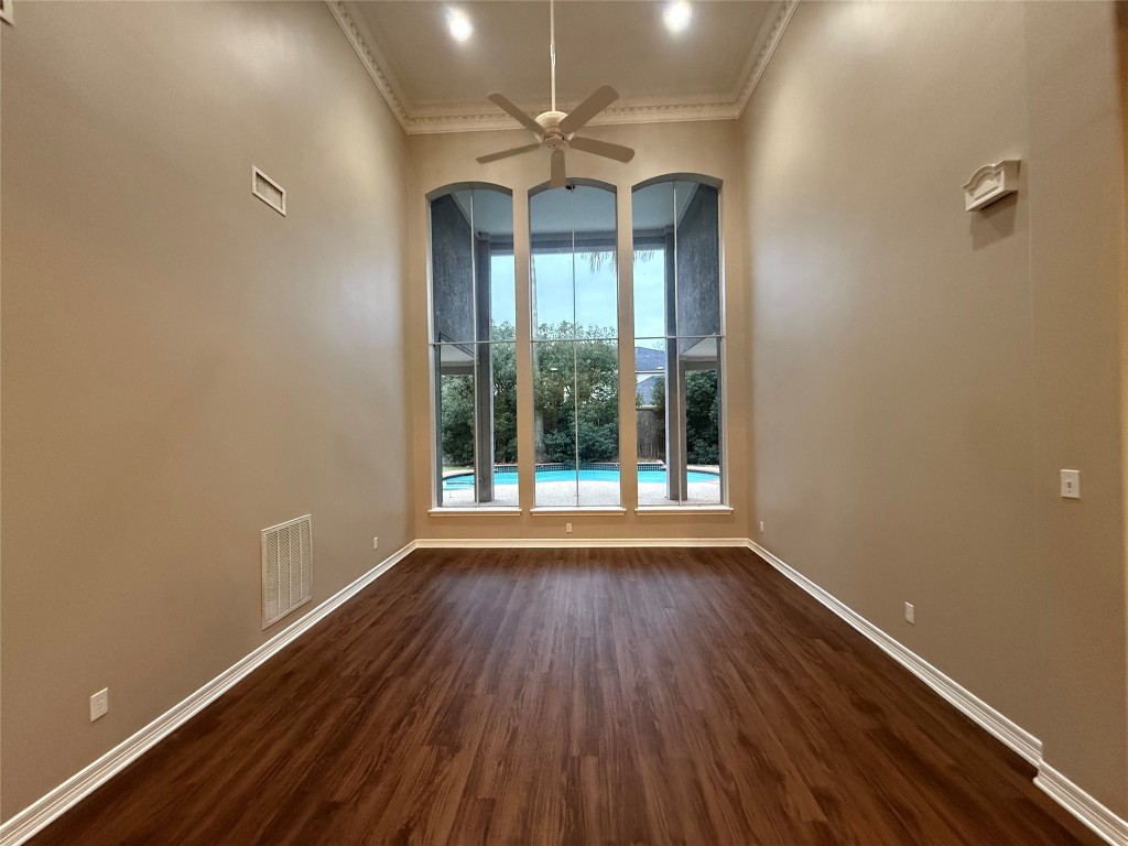 13523 Pegasus Road Cypress, TX 77429 - Photo 8 of 36 wooden floor in an empty room with a window