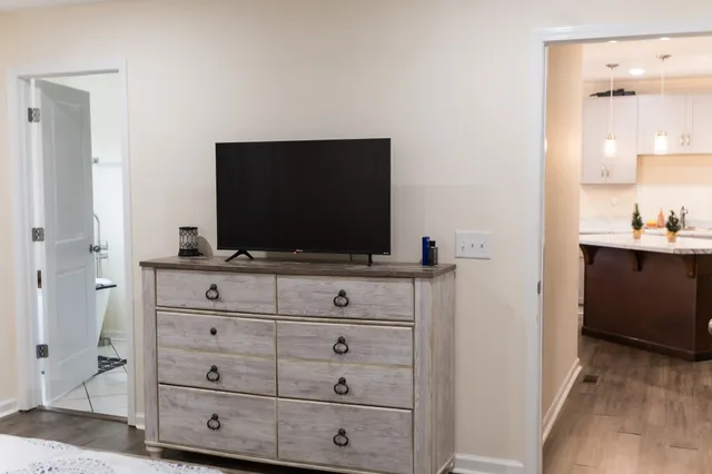 a living room with flat screen tv
