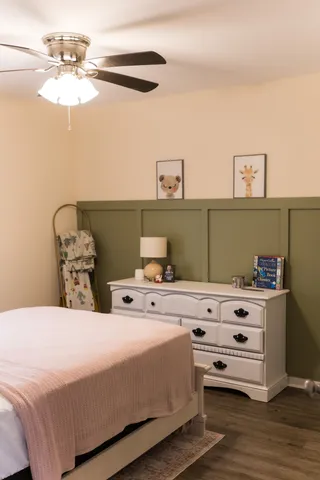 a bed room with a bed and a chandelier