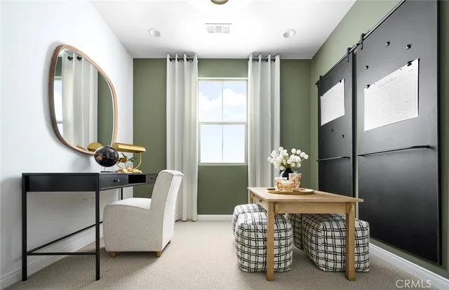 a living room with furniture a window and a chandelier