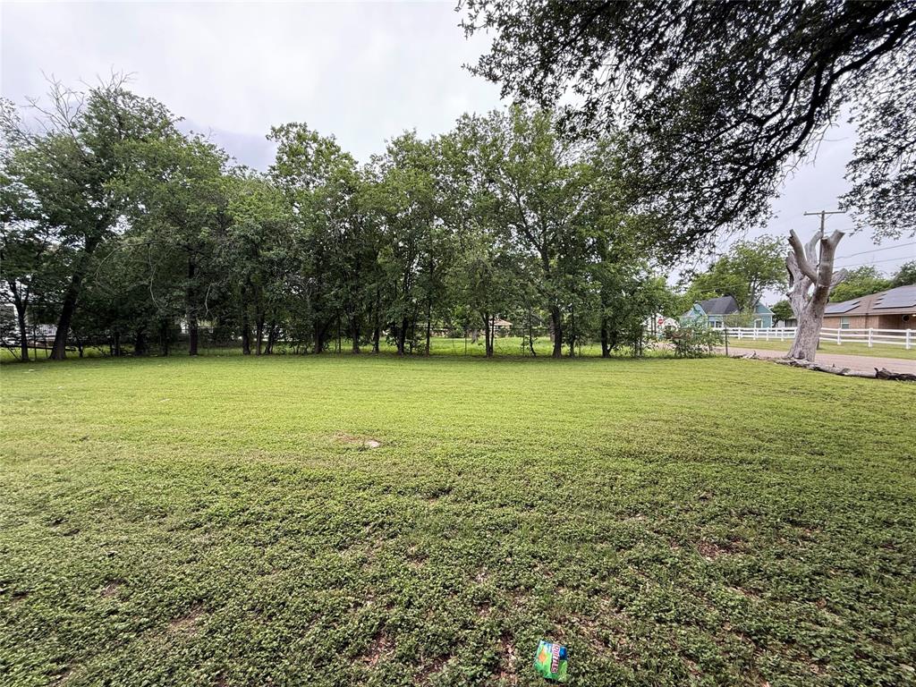516 Indiana Avenue Waco, TX 76707 - Photo 2 of 6 a view of a green field with trees in the background