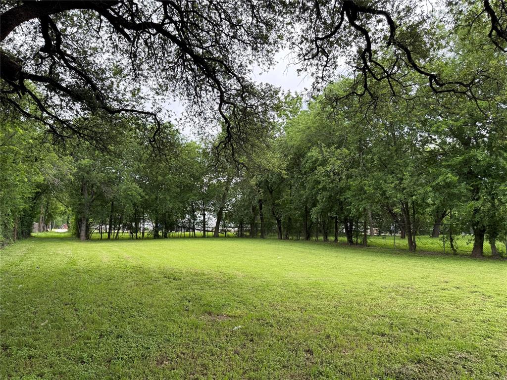 516 Indiana Avenue Waco, TX 76707 - Photo 3 of 6 a view of a field with trees in the background