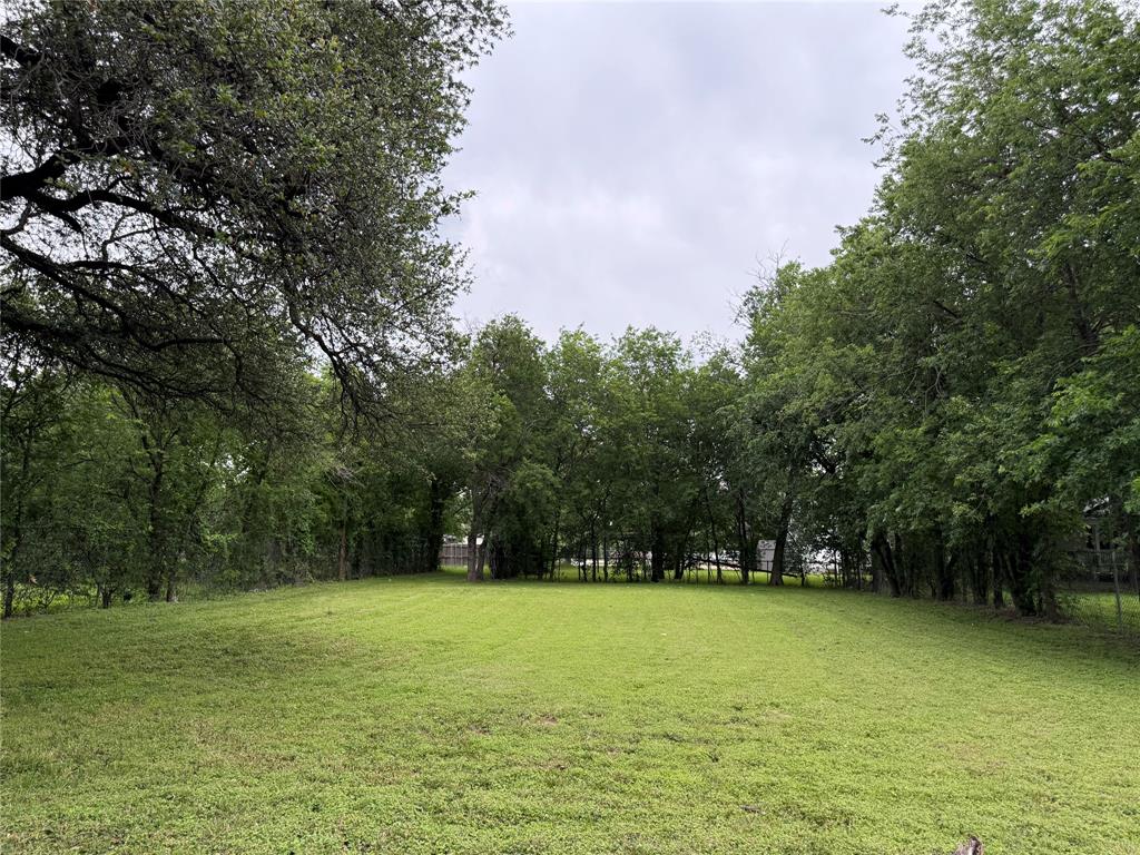 516 Indiana Avenue Waco, TX 76707 - Photo 5 of 6 a view of swimming pool with trees in background