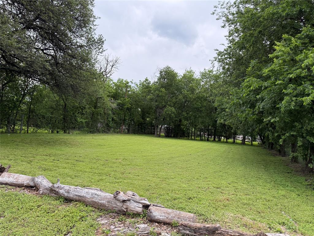 516 Indiana Avenue Waco, TX 76707 - Photo 6 of 6 a view of a lake with a large trees