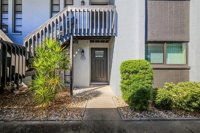 a view of a house with a flower garden