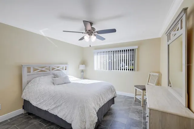 a bedroom with a bed furniture and a window