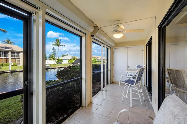 a view of a hallway with dining area and glass door