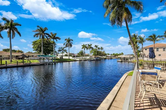 a view of swimming pool with a table and chairs