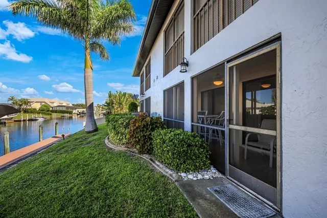 a view of a swimming pool with lounge chairs