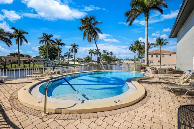 a view of a patio with a table and chairs