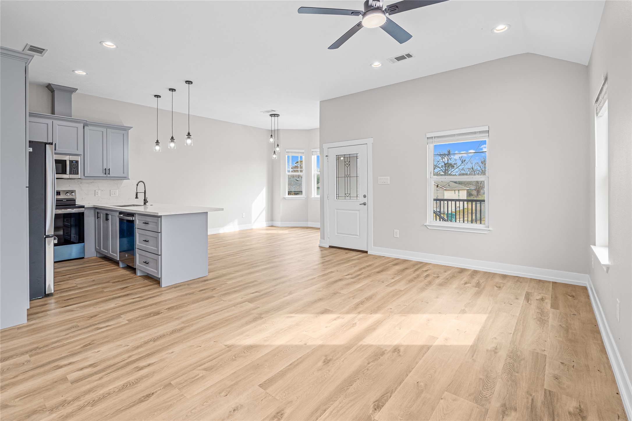 3821 Easy Street, Unit A Houston, TX 77026 - Photo 3 of 10 a view of kitchen and kitchen with a wooden floor