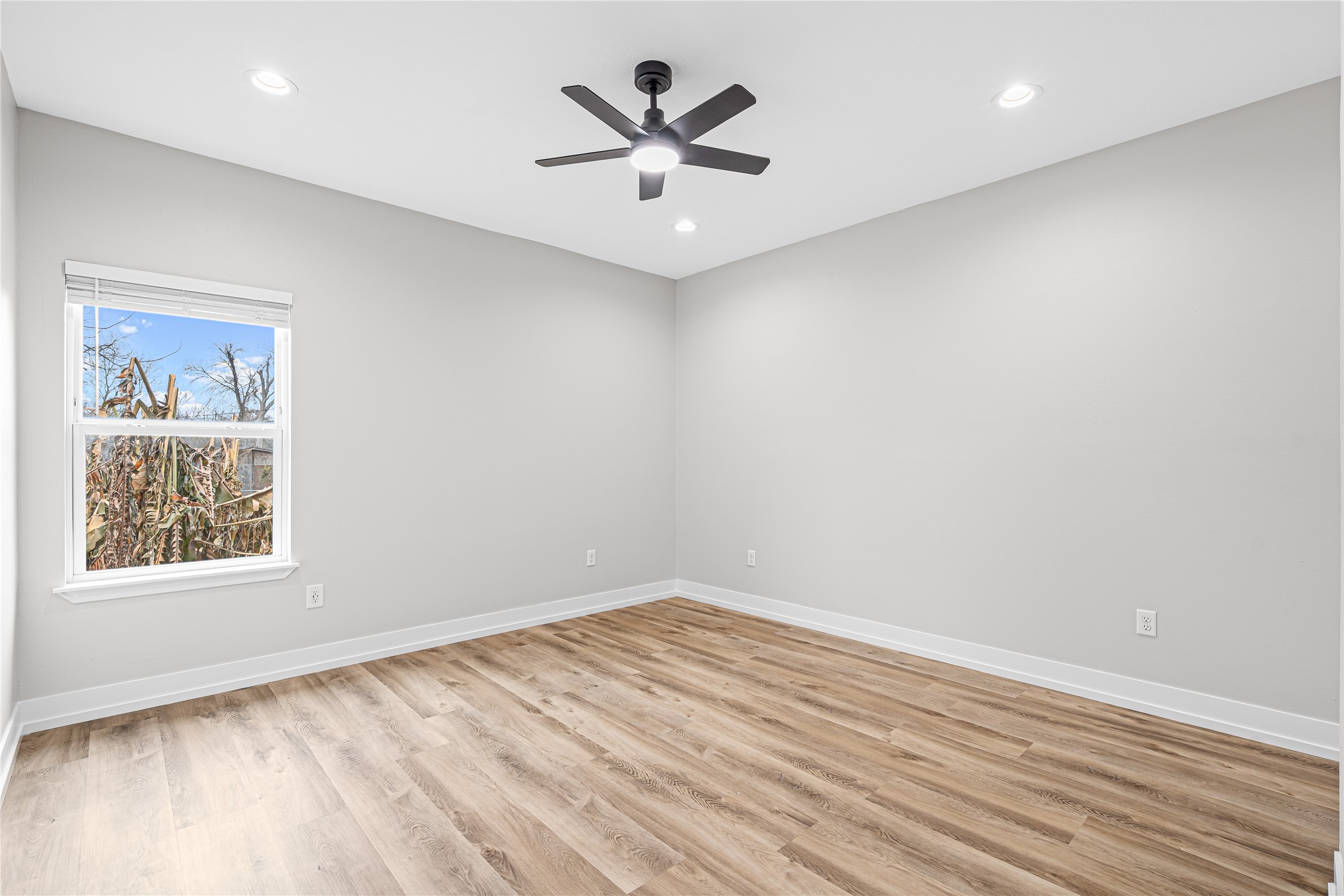 3821 Easy Street, Unit A Houston, TX 77026 - Photo 6 of 10 wooden floor in an empty room with a window