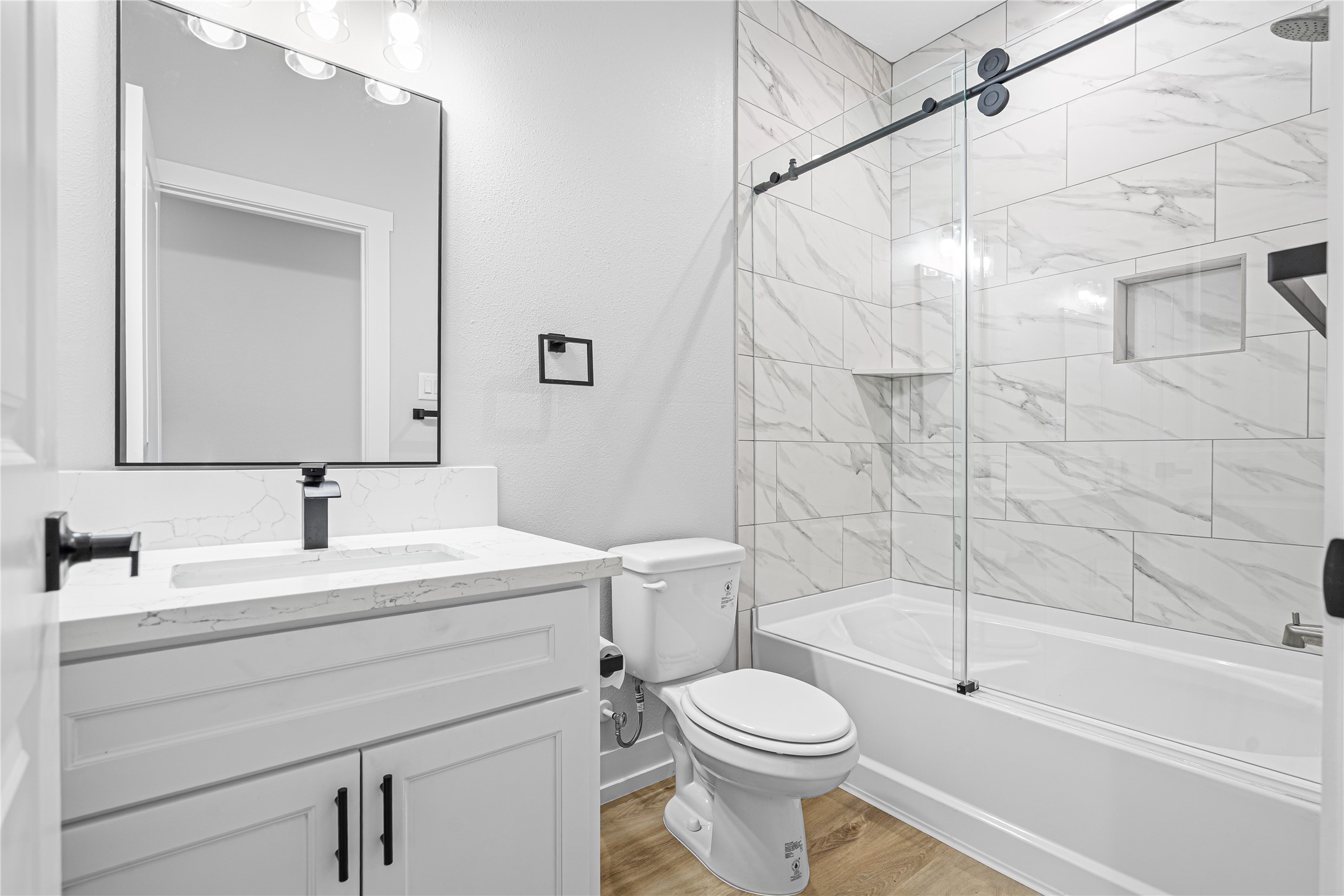 3821 Easy Street, Unit A Houston, TX 77026 - Photo 10 of 10 a bathroom with a toilet a sink and a bathtub
