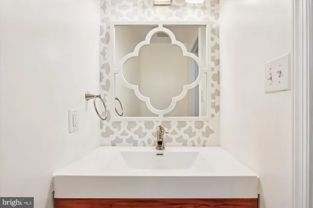 a view of hallway with wooden floor