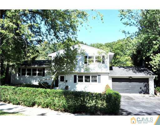 9 Agate Road East Brunswick, NJ 08816 - Photo 1 of 19 a front view of a house with a garden