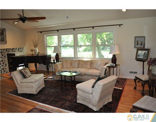 9 Agate Road East Brunswick, NJ 08816 - Photo 2 of 19 a living room with furniture and a large window