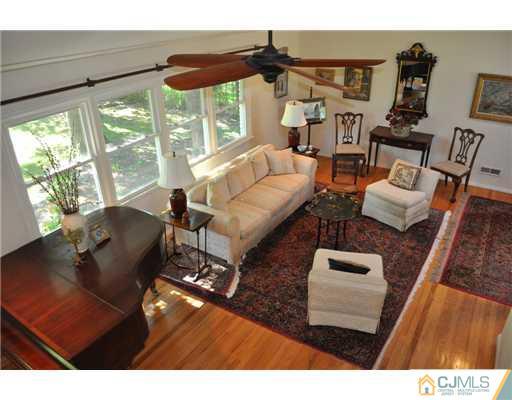 9 Agate Road East Brunswick, NJ 08816 - Photo 3 of 19 a living room with furniture and a large window